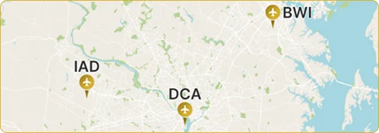 A stylized map showing the locations of the three major airports serving the Washington D.C. area: IAD (Dulles International Airport) to the west, DCA (Ronald Reagan Washington National Airport) closer to the center near the river, and BWI (Baltimore/Washington International Thurgood Marshall Airport) to the northeast near the Chesapeake Bay. Each airport is marked with an airplane and a location pin icon.