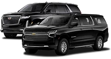 Two black full-size SUVs, a Cadillac Escalade and a Chevrolet Suburban, displayed against a neutral background